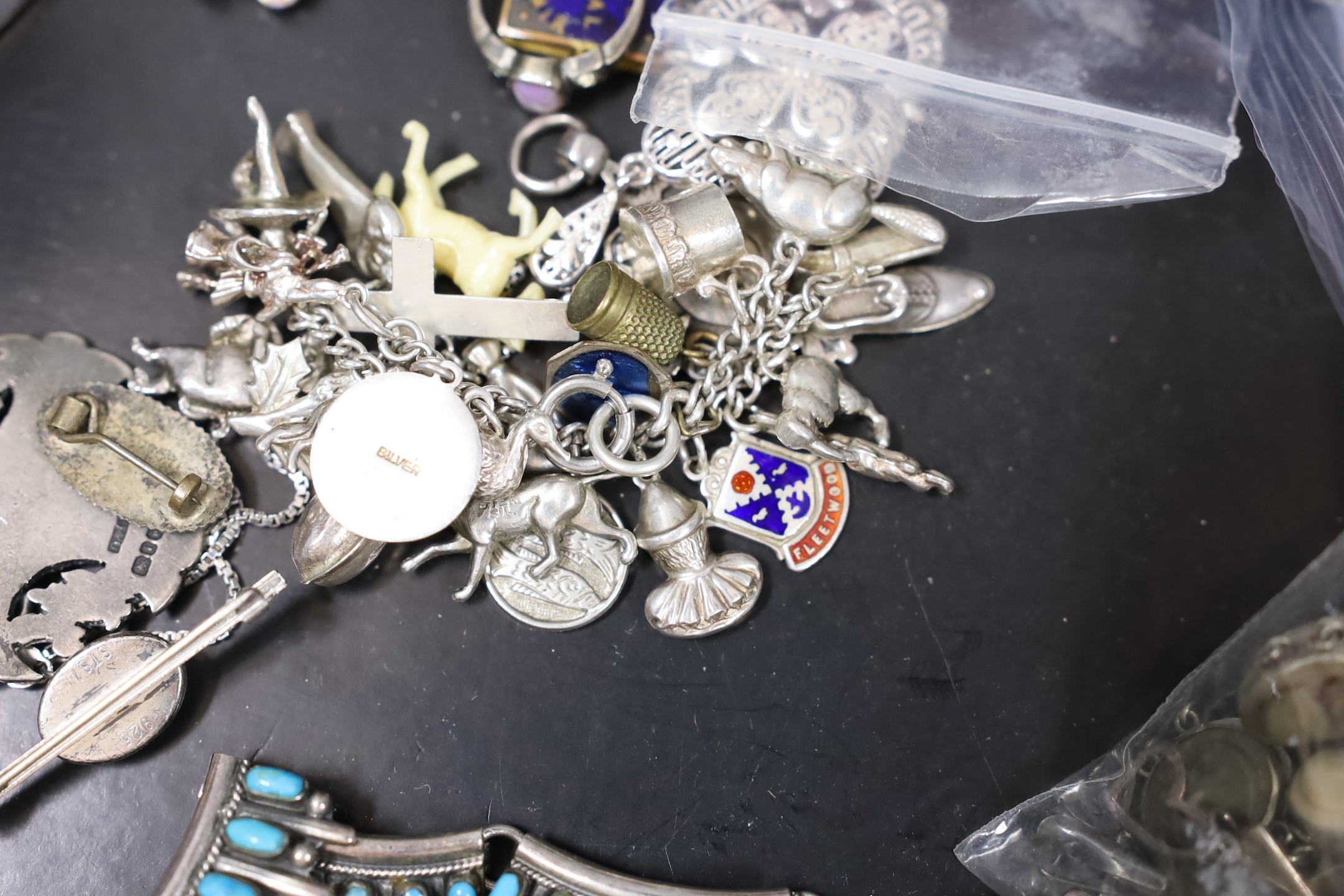 Mixed costume jewellery and other items including silver charm bracelet and silver and enamel baby brooch, Maundy money and a silver mounted dwarf candlestick.